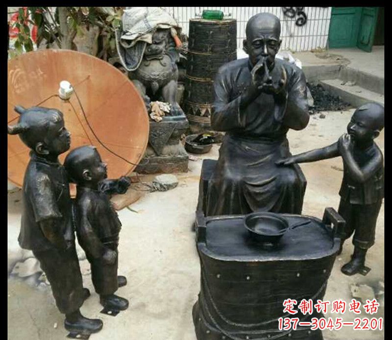 安阳步行街吹糖人的人物铜雕