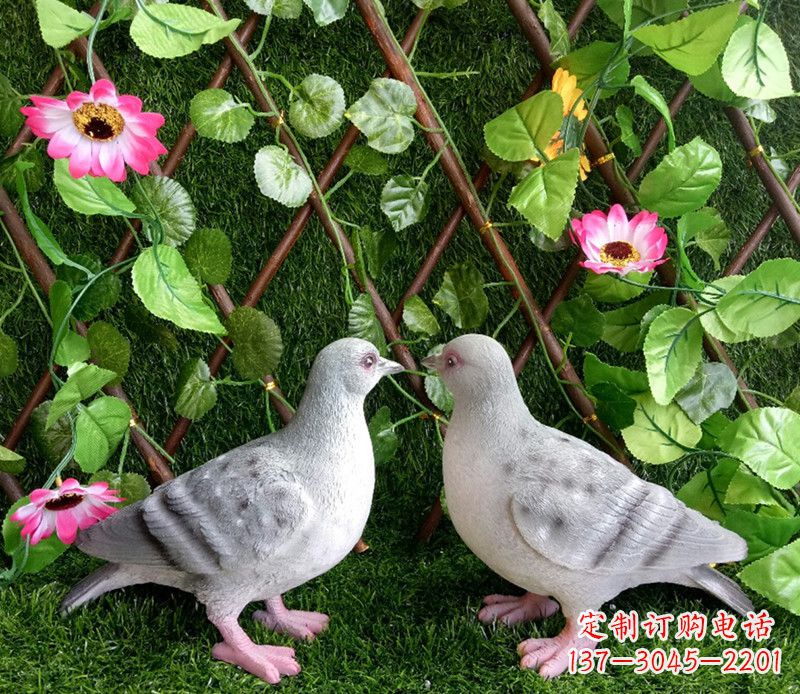 安阳雕塑小女孩一只手拿书一手和平鸽