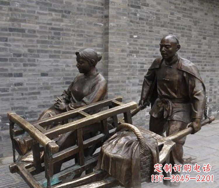 安阳推独轮车的人物铜雕